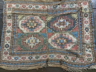 Antique Moghan Kazak Fragment. Cut and shut and both ends then sewn together and with a large patch and a 4"slit. Some good pile but overall rough condition.
Probably late 19thC and with  ...