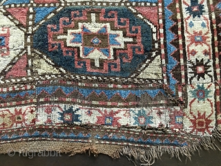 Antique Moghan Kazak Fragment. Cut and shut and both ends then sewn together and with a large patch and a 4"slit. Some good pile but overall rough condition.
Probably late 19thC and with  ...