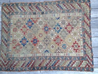 Early Shirvan snowflake design rug, ca 1870. Good natural colors, very low evenly worn pile. Exceptional palette reflecting good age. Missing outer borders on both ends. Yellow field and good variety of  ...