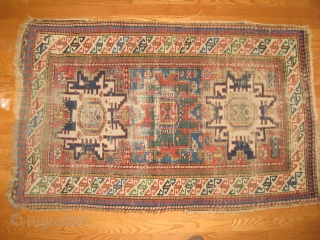 Lesghi Star rug circa 1870s. partially worn yet restorable. Clear saturated natural colors combined with a crisp design. An especially beautiful green in central medallion. 4'8" X 3'. Clean and ready for  ...