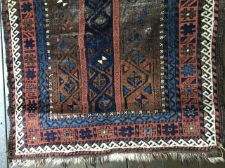 Antique Baluch rug circa late 19thC. Unique palette with field consisting of border designs. All natural colors including a brilliant light blue. Fair condition with areas of wear as well as places  ...