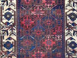 Antique Baluch rug, circa last quarter 19th C. All colors derived from natural dyes. Rare aubergine field. Abrashes as seen in photos. Good medium pile, lower in center. Soft,thin blanket-like handle. Unusual  ...