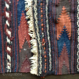 Baluch Balisht kilim backing from the late 19th C. Retains closure loops. All natural attractive colors and in excellent condition. Size 3'6" X 1'10"/107X56cm.
Washed. White stripes are embroidery. Shipping included within the  ...