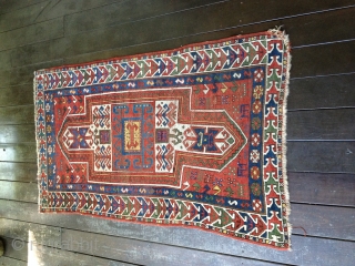 Small Antique Sewan Kazak rug, probably late 19th C. Bright saturated natural colors including nice lemon yellow and a generous use of green. Condition: even wear with some knots showing. No repairs  ...