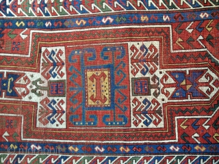 Small Antique Sewan Kazak rug, probably late 19th C. Bright saturated natural colors including nice lemon yellow and a generous use of green. Condition: even wear with some knots showing. No repairs  ...