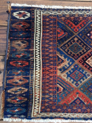 Early Jaf Kurd chuval fragment. Beautiful saturated natural colors that include a good variety of blues and blue-greens. Missing top and bottom borders.  Worn condition and with a patch from another  ...