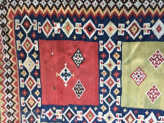 Striking Qashqui Kilim rug from the late 19thC. or early 20thC. All good saturated colors including aubergine. Size: 7ft. 9in. X 5ft. Good condition but with some worn areas as shown in  ...