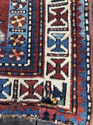 Unusual Antique Caucasian Rug, late 19th Century. Bright saturated colors, mostly all natural with the exception of a light red and possibly the pink. Unusual tulip design field. White main border with  ...