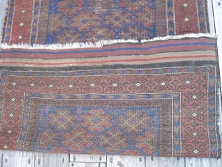 Late 19th C. Balouch rug. Nice colors including a great electric blue. Overall
low pile with wear as shown. Retaining almost all of kilim ends and all original selvedges. Size 65X32in/165X81cm. Washed. Price  ...