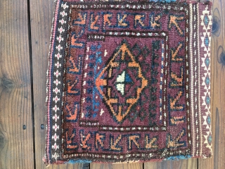 Two antique Baluch pieces: 1. Baluch "Chanteh, size 15"X16". Good condition and complete with full pile and backing. 2. Camel hair field Baluch Balisht, size 30"X 19". Worn condition with fraying of  ...