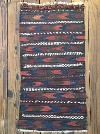 Antique Baluch Kilim which appears to be a bagface to a grainbag. Very good condition and retains closure loops. Measures 42"X 22". Hand washed. Shipping included in price.     