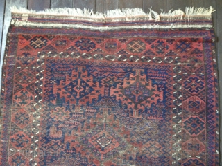 19th C. Baluch Main Carpet, 79"X48"/201X122cm. All natural dyes. Dark palette. Thin, soft floppy handle. Very evenly worn but still makes a statement with a good variety of design symbols. Retains part  ...