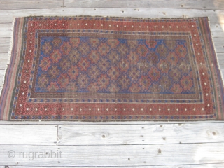 Late 19th C. Baluch rug, Good natural colors including a great electric blue. Overall low pile with wear as shown. Retaining kilim ends and original selvedges. Size 65X32in/165X81cm. Washed. Reasonable. Price reduced.  ...