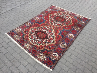 Colorful Persian Bakhtiary rug with lots of flowers and birds, age: circa 1920, size: ca. 205x150cm / 6'7''ft x 5ft             