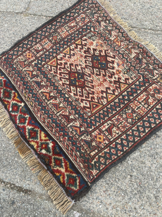 A very charming antique Luri Bakhtiary bagface. Lovely design displaying a camel caravan surrounding the center. Woven in Sumakh technique with a handknotted bottom. Size circa 45x40cm / 1’5ft by 1’3ft very  ...