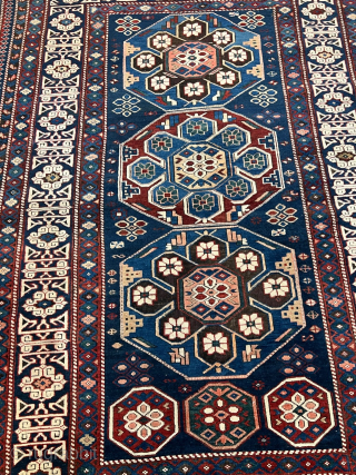 Antique Caucasian Shirvan rug with Kufic border. Beautiful shades of indigo, azure and navy blue are complemented by intricate geometric motifs, woven with precision and skill. The Kufic border adds a touch  ...