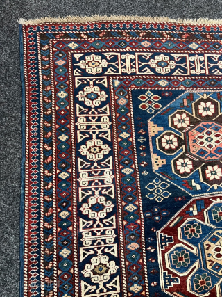 Antique Caucasian Shirvan rug with Kufic border. Beautiful shades of indigo, azure and navy blue are complemented by intricate geometric motifs, woven with precision and skill. The Kufic border adds a touch  ...