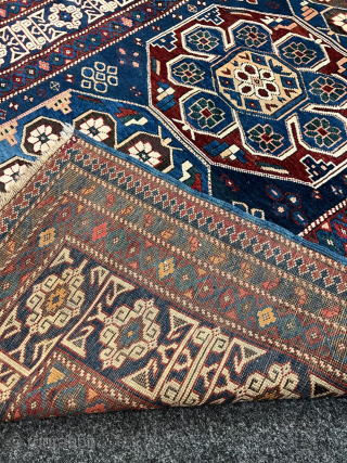 Antique Caucasian Shirvan rug with Kufic border. Beautiful shades of indigo, azure and navy blue are complemented by intricate geometric motifs, woven with precision and skill. The Kufic border adds a touch  ...