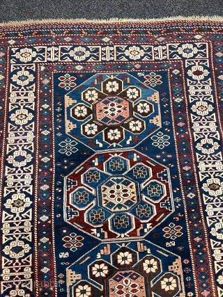 Antique Caucasian Shirvan rug with Kufic border. Beautiful shades of indigo, azure and navy blue are complemented by intricate geometric motifs, woven with precision and skill. The Kufic border adds a touch  ...