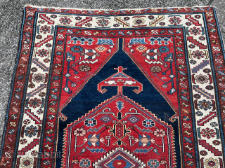 This antique village rug from Northwest Persia has a very nice geometric design and beautiful colors like shades of crimson, red, indigo and navy blue. The size is: 193x127cm / 6‘4ft by  ...
