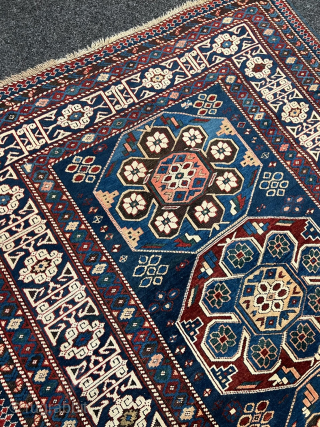 Antique Caucasian Shirvan rug with Kufic border. Beautiful shades of indigo, azure and navy blue are complemented by intricate geometric motifs, woven with precision and skill. The Kufic border adds a touch  ...