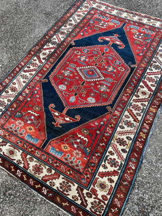 This antique village rug from Northwest Persia has a very nice geometric design and beautiful colors like shades of crimson, red, indigo and navy blue. The size is: 193x127cm / 6‘4ft by  ...