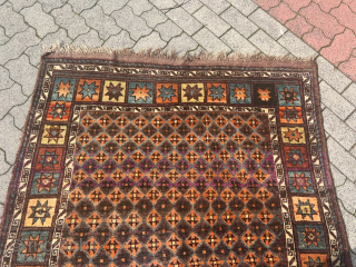 Antique Kordi rug from Khorassan province of Northeast Persia, good condition with full chunky pile. Glossy, shiny wool.  Its intricate design features a mesmerizing interplay of earthy brown tones, evoking a  ...