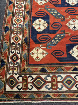 A Caucasian masterpiece: Impressive antique Pinwheel Kazak or so called Swastika Kazak from the mid-19th. Very well balanced geometric design and deep natural dyes. Good overall condition with original sides and ends.  ...
