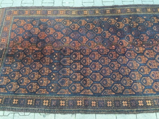This unusual large antique Baluch rug from West - Afghanistan was woven in two parts. It has long kilim ends. Good overall condition. Size: ca. 280cm x 135cm / 9'2''ft x 4'4''ft  ...