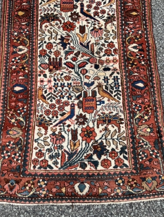 A lovely small antique Persian Bakhtiary rug with birds and flowers, size: ca. 125x70cm / 4’1ft by 2’3ft               