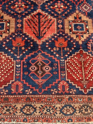 Antique Persian Bakhtiary rug with garden design. The indigo blue field is surrounded by a beautiful camel ground border. Size: circa 197x163cm / 6’5ft by 5’3ft http://www.najib.de      