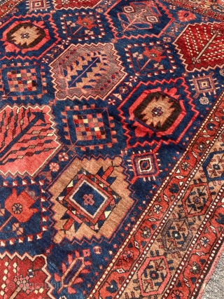 Antique Persian Bakhtiary rug with garden design. The indigo blue field is surrounded by a beautiful camel ground border. Size: circa 197x163cm / 6’5ft by 5’3ft http://www.najib.de      