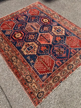 Antique Persian Bakhtiary rug with garden design. The indigo blue field is surrounded by a beautiful camel ground border. Size: circa 197x163cm / 6’5ft by 5’3ft http://www.najib.de      