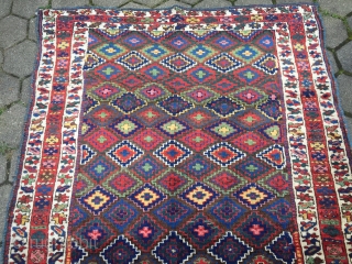 Antique Kurdish Saujbulagh tribal rug with fantastic colors and shiny wool. Circa 1870. Size: ca. 260x140cm / 8'5'' x 4'6''ft The design of this village weaving displays interlocking stepped diamonds that completely  ...