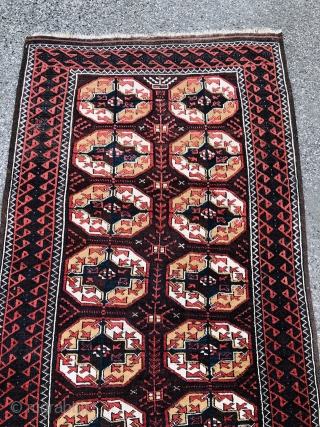 Antique Turkmen inspired Baluch rug with "Tekke Gul" design. Size: ca. 210x105cm / 7ft by 3'5''ft good overall condition, little old moth damage.          