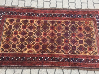 A very nice antique camel ground Baluch rug with saturated colors, shiny wool and a very well executed hooked design. The size is circa 170x90cm / 5'6''ft x 3ft    