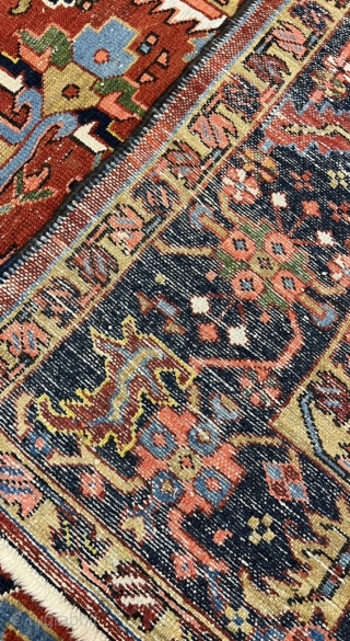 A highly decorative antique Persian Heriz carpet. Beautiful blue corners, size: ca. 345x290cm / 11’3ft by 9’5ft some localized wear.             