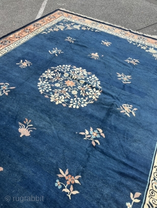 Antique Chinese Peking rug. Very decorative, beautiful blue field color, salmon border. Age: circa 1900, size: ca. 405x310cm / 13’3ft by 10’2ft , some localized wear. www.najib.de      