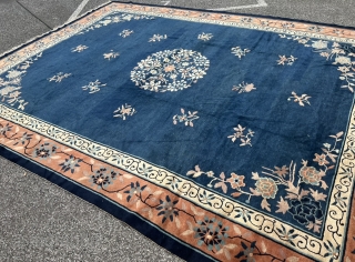 Antique Chinese Peking rug. Very decorative, beautiful blue field color, salmon border. Age: circa 1900, size: ca. 405x310cm / 13’3ft by 10’2ft , some localized wear. www.najib.de      