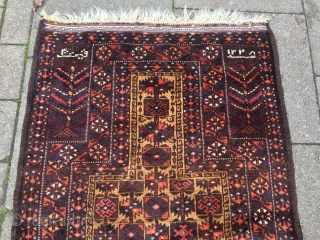 Rare Baluch prayer rug, signed and dated, size: 140x85cm / 4'6''ft x 2'8''ft, good condition except for a tiny old moth damage.           