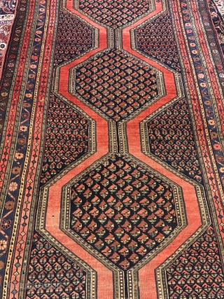 Antique Northwest Persian village rug from the Meshkin area. A perfect interaction between the pole medallion and the field design seperated by a brick red plane field. Size: ca. 405x155cm / 13'3''ft  ...