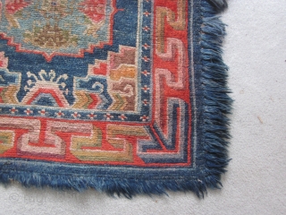 Tibetan runner or sitting/sleeping rug with 3 large guls and Chinese and Tibetan symbols, Some minor border repairs, about 3 by 6 ft,c.1930          