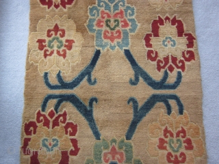 Tibetan khaden, abt 3 by 6 ft, c.1925, with spacious flower and vine design on tan ground                