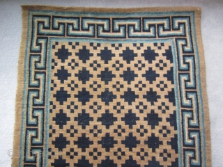 Tibetan:Khaden with geometric central design and attractive blue key border, about 3 by 6 ft, c.1930                 