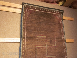 Tibetan, CORRECTION) Two large swastikas on brown field with small corner frets; exhibited at 1998 ACOR Conf., Denver: 27 by 62 inches, post-1900          