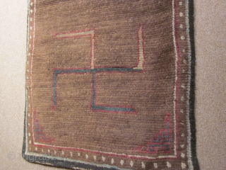 Tibetan, CORRECTION) Two large swastikas on brown field with small corner frets; exhibited at 1998 ACOR Conf., Denver: 27 by 62 inches, post-1900          