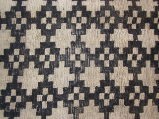 Tibetan mat, with overall geometric design, possibly cut down from larger rug, 2'8" by 3' c.1900 Signs of wear. Not expensive.            