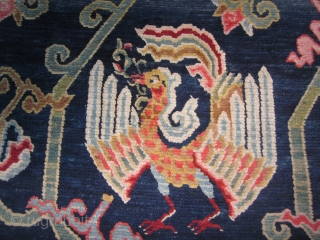 Tibetan khaden, floral elements, including lotuses, and two phoenixes (that look like peacocks!) on indigo ground, c.1930, 2'11" by 5'6" $700            