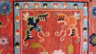 Tibetan, small mat, 18 by 35 inches, possibly for table top use.Sewn on border covers about 1 inch of outer edge. After 1900          