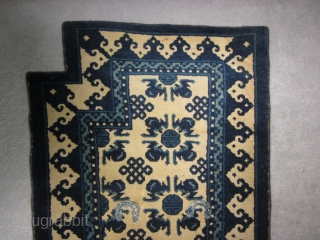 Chinese Ningshia bottom saddle rug, early 20th, 24 by 52 inches. Plush wool. Excellent condition with secured selvedges and over-sewn cinch strap holes
SOLD          